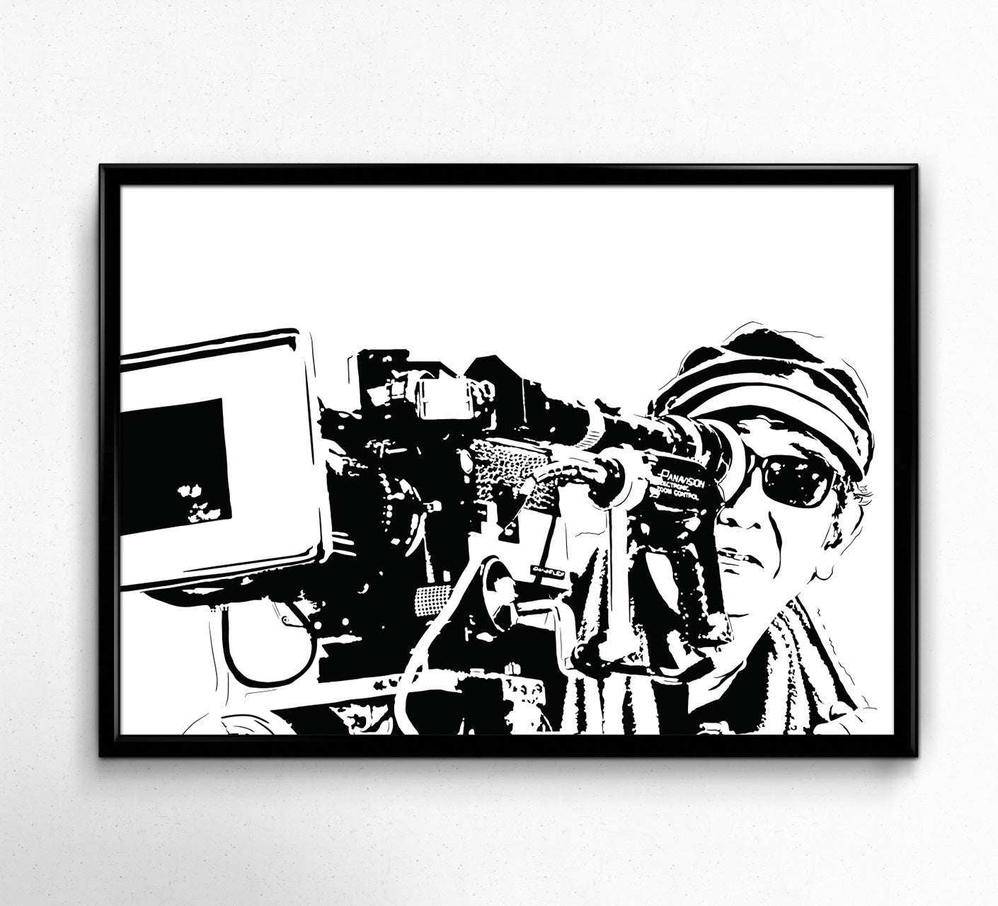 Black and white framed stencil illustration of Akira Kurosawa, a famous Japanese filmmaker, standing in front of a film recorder. Kurosawa is depicted with his trademark thick-rimmed glasses, looking intently at the recorder. The background is white with intricate stencil details giving the illustration a unique and minimalist style